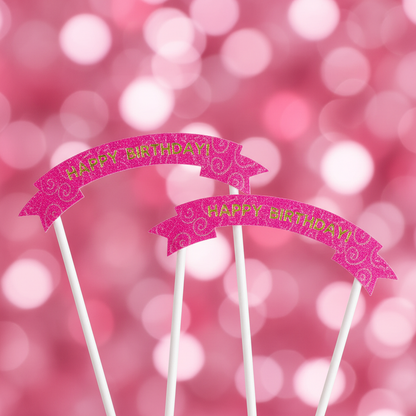 Close up detail of hot pink Happy Birthday arch ribbon banner cake toppers on white sticks