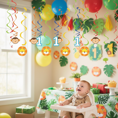 Colorful swirl danglers with cute monkey and lion faces hanging from ceiling at baby boy first birthday jungle safari party