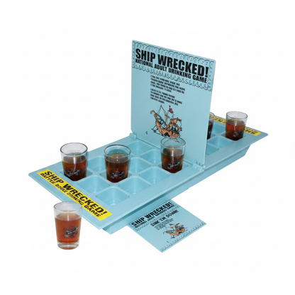 Ship Wrecked Battle Shots drinking board game flat lay on white background with shot glasses and instruction card